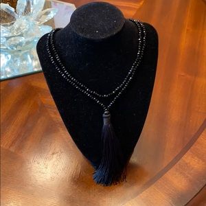 Long black tassel necklace